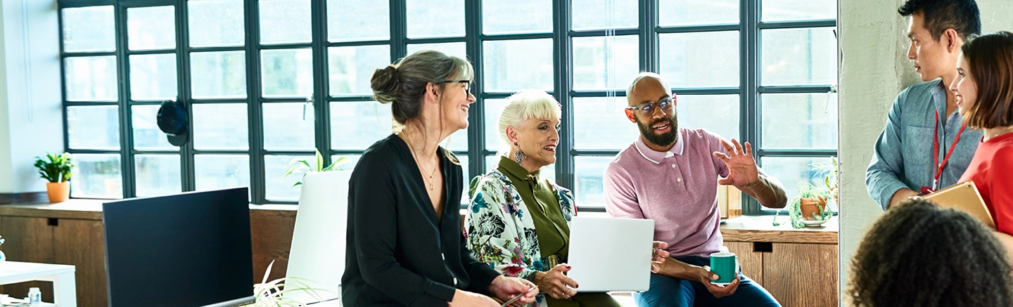 People in a meeting and smiling