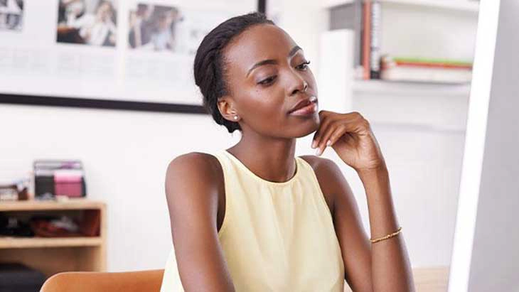 Woman with hand on chin and thinking