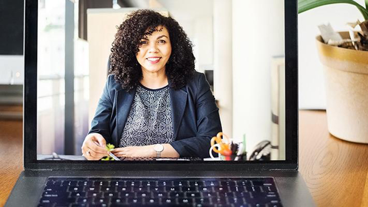 Image of woman in laptop screen 