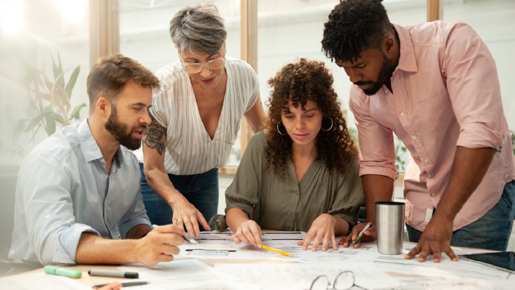 Team collaborating on charts and documents - Ireland top skills report 2026.